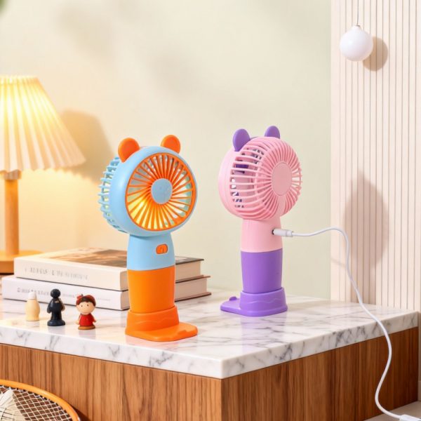 Orange and purple bear-ear mini fans with desktop bases and USB charging cable