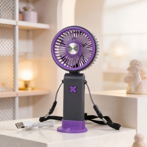 Purple rechargeable handheld fan with purple base and lanyard, shown on a tabletop