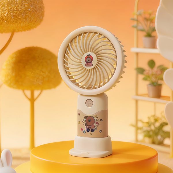 Beige capybara sticker-style rechargeable mini fan with desktop base