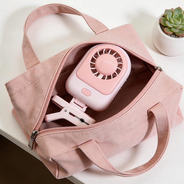 Pink mini clip-on fan carried inside a handbag; handbag not included