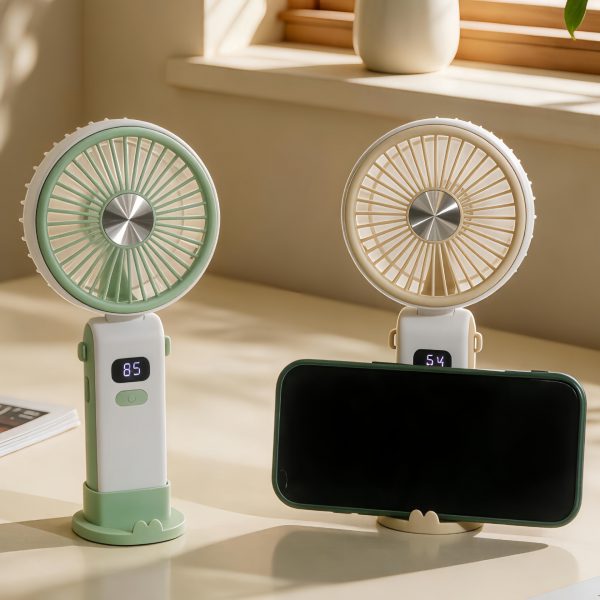 Green and Brown foldable digital-display handheld fans on desktop bases, with a phone illustrating the support slot; choose one fan color