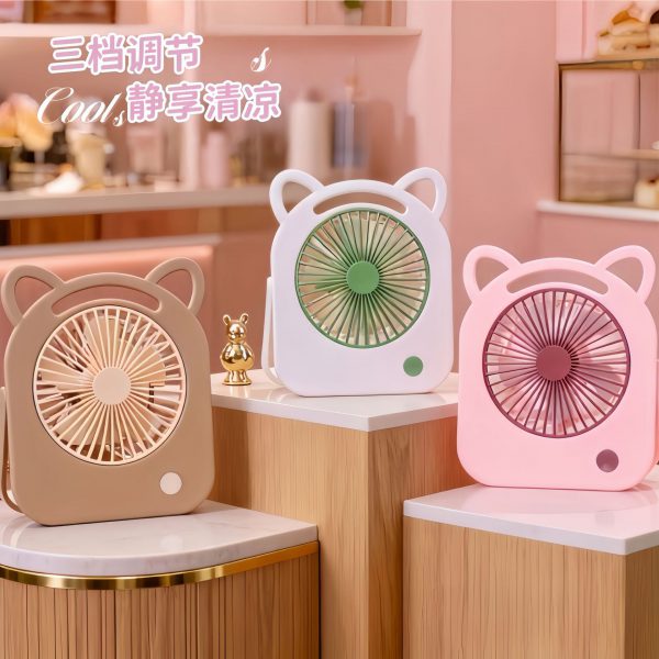 Three cat-ear mini fans in pink, white and light coffee