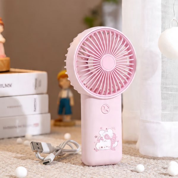 Pink USB rechargeable handheld fan with cartoon handle and carrying loop