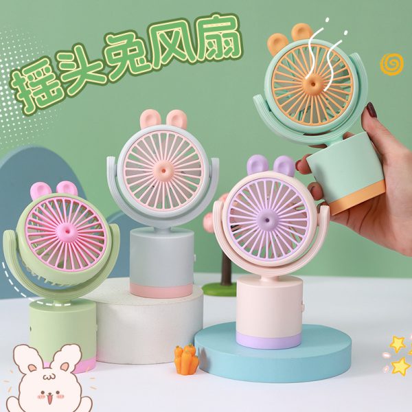 Turn-head rabbit handheld fans on cylindrical bases in multiple colors; select one style and color