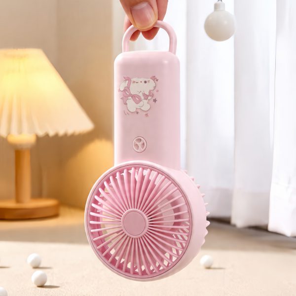 Pink cartoon handheld fan held by its integrated carrying loop