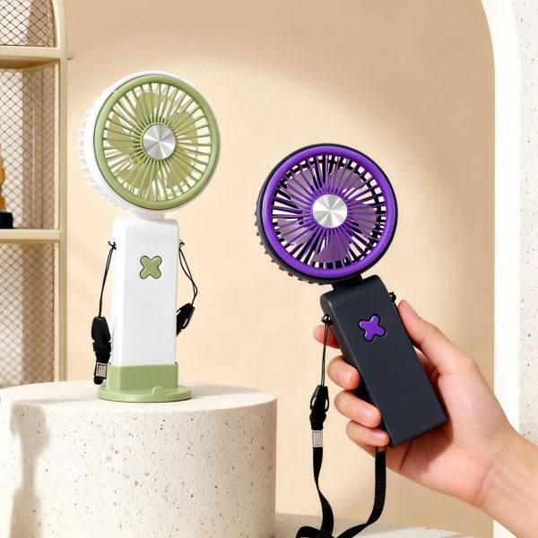 Purple fan held in a hand beside Green fan standing on its tabletop base; fans sold individually