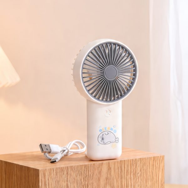 White USB rechargeable handheld fan with cartoon handle and carrying loop