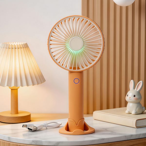 Yellow rechargeable handheld fan with desktop base, light and USB cable