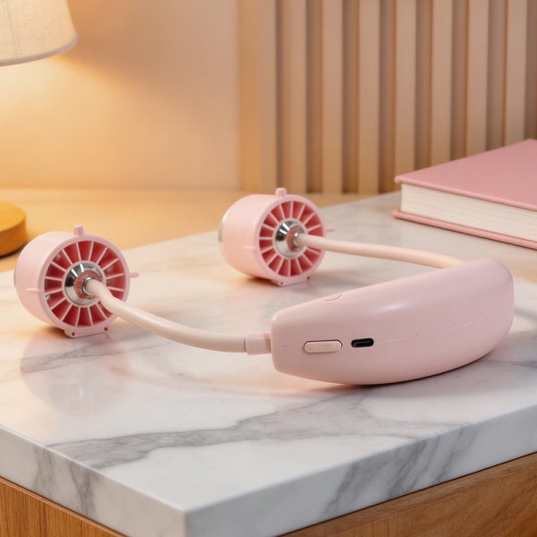 Pink dual-head neck fan on a marble tabletop