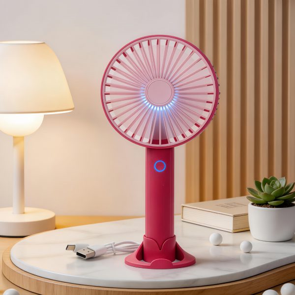 Red rechargeable handheld fan with desktop base, light and USB cable